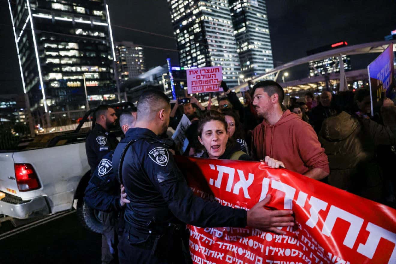 Israelis block the Ayalon Highway in Tel Aviv calling for the release of hostages held in Gaza, Jan. 24, 2024. Photo by Chaim Goldberg/Flash90.