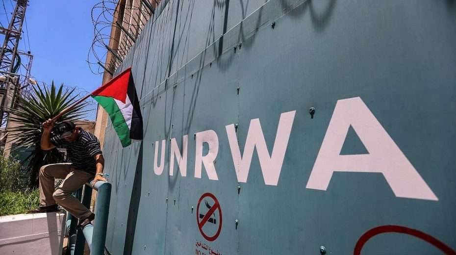 A Palestinian man outside the United Nations Relief and Works Agency for Palestine Refugees in the Near East (UNRWA) in Gaza City protests cuts to aid on June 20, 2023. Credit: Anas-Mohammed/Shutterstock.