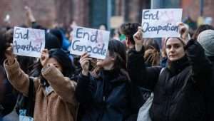 Activists hold banners during a solidarity demonstration for the Palestinians on October 18, 2023 in Berlin. Photo: EPA-EFE/CLEMENS BILAN