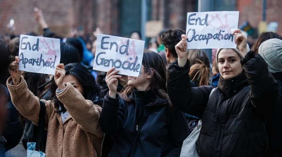 Activists hold banners during a solidarity demonstration for the Palestinians on October 18, 2023 in Berlin. Photo: EPA-EFE/CLEMENS BILAN