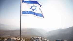 An Israeli flag in the Jordan Valley, near the community of Ma'ale Efraim, Jan. 2, 2014. Photo by Uri Lenz/Flash90.