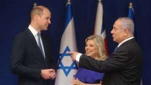 Prince William with Prime Minister Benjamin Netanyahu and his wife, Sara, during a 2018 visit to Israel. Photo by Marc Israel Sellem/POOL