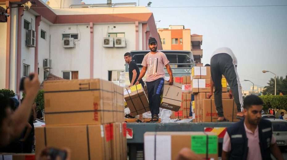 Palestinians unload medical aid from a truck at the Nasser hospital in Khan Yunis, in the southern Gaza Strip, on Oct. 23, 2023. Photo by Atia Mohammed/Flash90.
