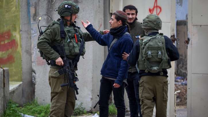 Israeli security forces secure the area while Israeli settlers visit the Old City, in the West Bank city of Hebron, on January 23, 2024. Photo by Wisam Haslamoun/FLASH90