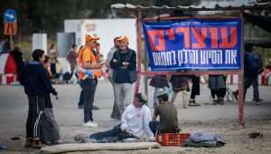 People protest against aid trucks entering Gaza, at Kerem Shalom in southern Israel, Feb. 22, 2024. Photo by Erik Marmor/Flash90.