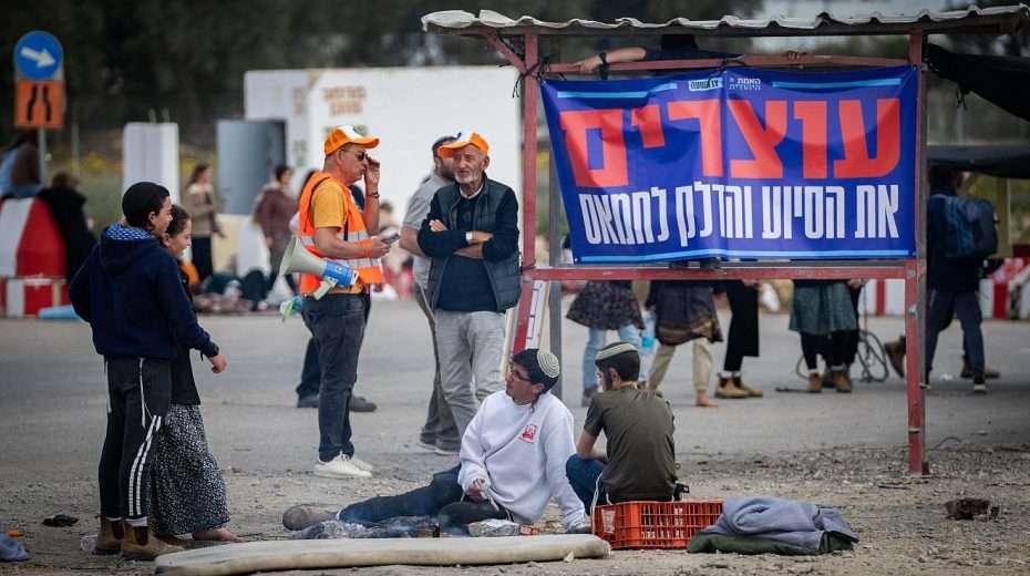 People protest against aid trucks entering Gaza, at Kerem Shalom in southern Israel, Feb. 22, 2024. Photo by Erik Marmor/Flash90.