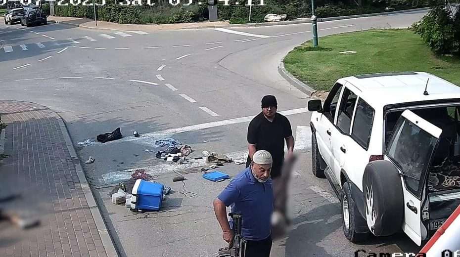 UNRWA social worker Faisal Ali Mussalem al-Naami (rear), carrying the body of a murdered Israeli man, is seen along with another terrorist at Kibbutz Be'eri, Oct. 7, 2023. Screenshot: South First Responders/Telegram.