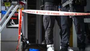 Police and security personnel at the scene of a stabbing attack in Beit Kama Junction, southern Israel, March 14, 2024. Photo by Dudu Greenspan/Flash90