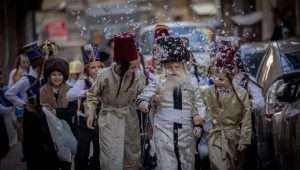 Ultra-Orthodox Jewish children march in their costumes through the ultra-Orthodox Meah Shearim neighborhood a few days before the Jewish festival of Purim on March 20, 2024. Photo: Chaim Goldberg/Flash90