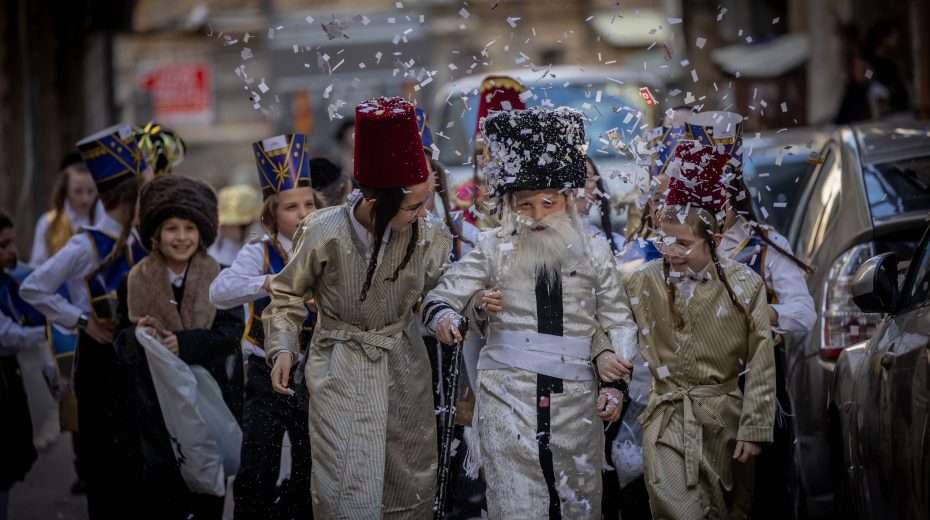 Ultra-Orthodox Jewish children march in their costumes through the ultra-Orthodox Meah Shearim neighborhood a few days before the Jewish festival of Purim on March 20, 2024. Photo: Chaim Goldberg/Flash90