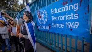 Activists protest against United Nations Relief and Works Agency for Palestine Refugees (UNRWA) outside their offices in Jerusalem, March 20, 2024. Photo by Yonatan Sindel/Flash90