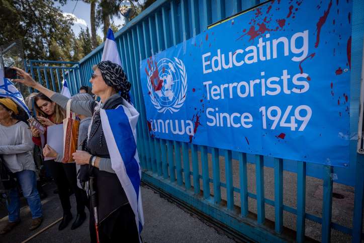 Activists protest against United Nations Relief and Works Agency for Palestine Refugees (UNRWA) outside their offices in Jerusalem, March 20, 2024. Photo by Yonatan Sindel/Flash90