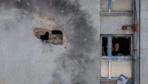 The damage after a rocket fired from Lebanon hit a building in the northern Israeli town of Kiryat Shmona, Feb. 11, 2024. Photo by David Cohen/Flash90.