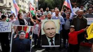 Palestinians in Hebron protest on behalf of their brethren in Gaza, with posters of Russian President Vladimir Putin and North Korean leader Kim Jong-un, following Hamas's Oct. 7 massacre of Israelis., Oct. 20, 2023. Photo by Wisam Hashlamoun/Flash90.