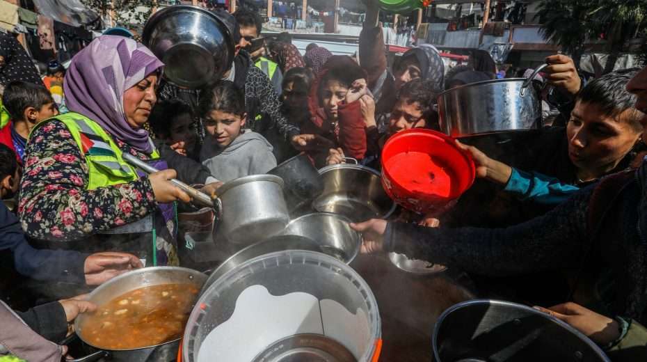People line up for food in the Gaza Strip. Photo: Shutterstock