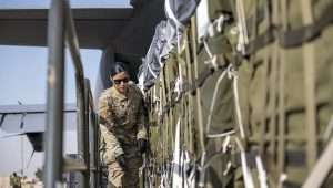 A US Air Force airman prepares bundles of humanitarian aid, including more than 38,000 halal meals, destined for an airdrop over Gaza on March 7, 2024. Credit: US Air Force photo.