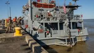 US soldiers with the 7th Transportation Brigade (Expeditionary) ready the USAV SP4 James A. Loux to deploy from Joint Base Langley-Eustis, Va. on March 12, 2024. The unit is deploying as part of a Joint Logistics Over-the-Shore mission to conduct 1,800-foot causeway off the coast of Gaza to enable the flow of critical aid from the sea to civilians affected by the ongoing conflict. Credit: Joseph Clark/US Department of Defense.