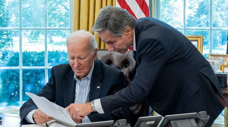 US President Joe Biden, joined by Secretary of State Antony Blinken, is briefed on the terrorist assault on Israel on Oct. 7, 2023, in the Oval Office of the White House. Credit: Cameron Smith/White House.