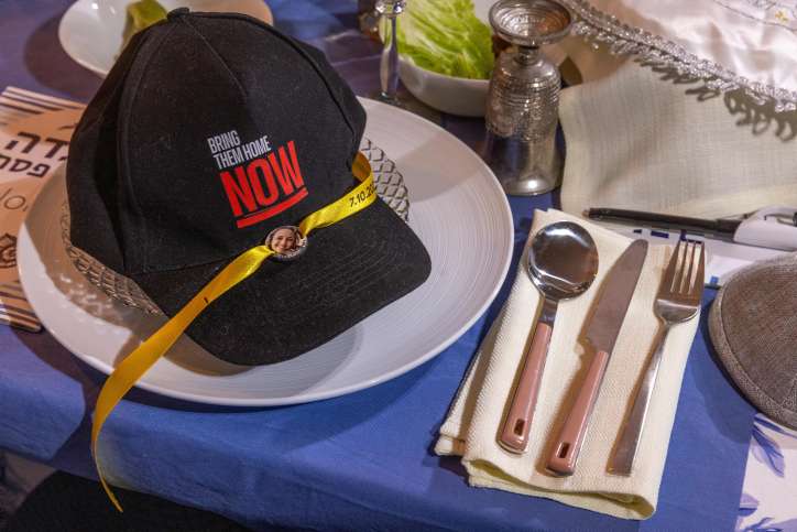 A Passover Seder table with an empty chair for the hostages who remain in Hamas captivity. Photo by Yossi Aloni/Flash90