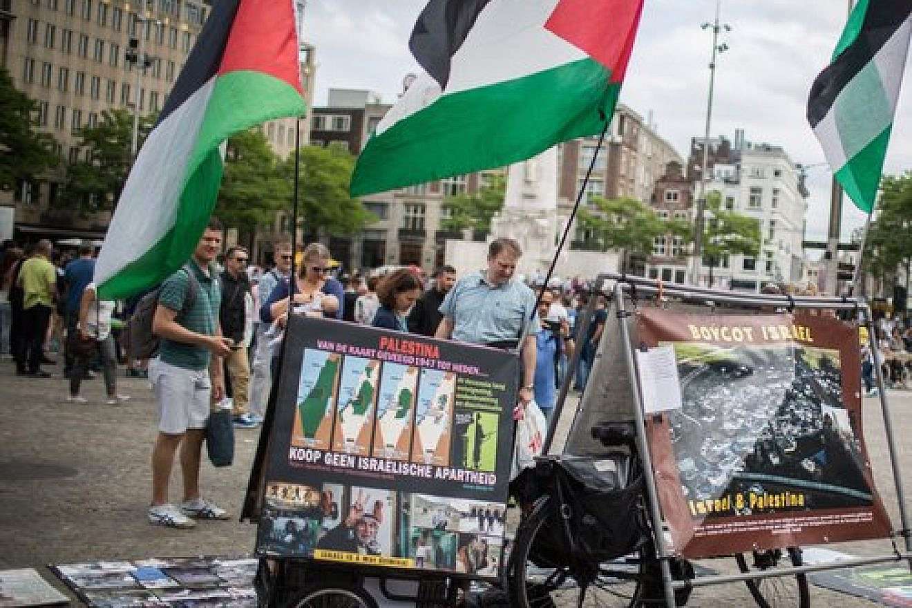 A pro-BDS display, with photos and Palestinian flags, at Dam Square in central Amsterdam June 24, 2016. Credit: Hadas Parush/Flash90.