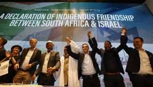 Members of the South Africa-based Nazareth Baptist Church sign a declaration of friendship with Israel at the Friends of Zion Museum in Jerusalem, May 12, 2024. Credit: Yossi Zamir.