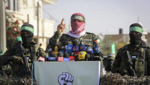Abu Ubaida (center), the spokesman of the Izz al-Din al-Qassam Brigades, the "military" wing of Hamas, speaks in the southern Gaza Strip on Nov. 11, 2019. Photo by Abed Rahim Khatib/Flash90.