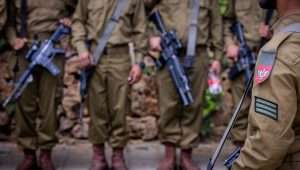 Israeli soldiers from the Netzah Yehuda Battalion visit graves of fallen Israeli soldiers at Mount Herzl Military Cemetery in Jerusalem, on May 12, 2024, ahead of Israeli Memorial Day, which began on Sunday night, May 12, 2024. Photo by Chaim Goldberg/Flash90.