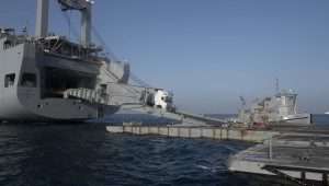 Aid trucks driving onto the US-built temporary floating pier off the Gaza coast, May 17, 2024. Credit: US Central Command.