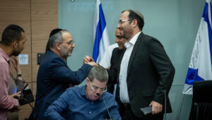 Shas MK Erez Malul (left) and Religious Zionism MK Simcha Rothman, head of the Constitution, Law and Justice Committee, at the Knesset in Jerusalem, July 19, 2023. Photo by Yonatan Sindel/Flash90.