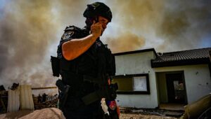 Police at the site where a rocket fired by Hezbollah in Lebanon hit and caused damage in the northern Israeli town of Katzrin, June 13, 2024. Photo by Michael Giladi/Flash90.