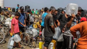 Palestinians line up in the Gaza Strip to receive drinkable water numbers while battles take place between Israel and Hamas in the southern city of Rafah on May 20, 2024. Photo by Abed Rahim Khatib/Flash90.