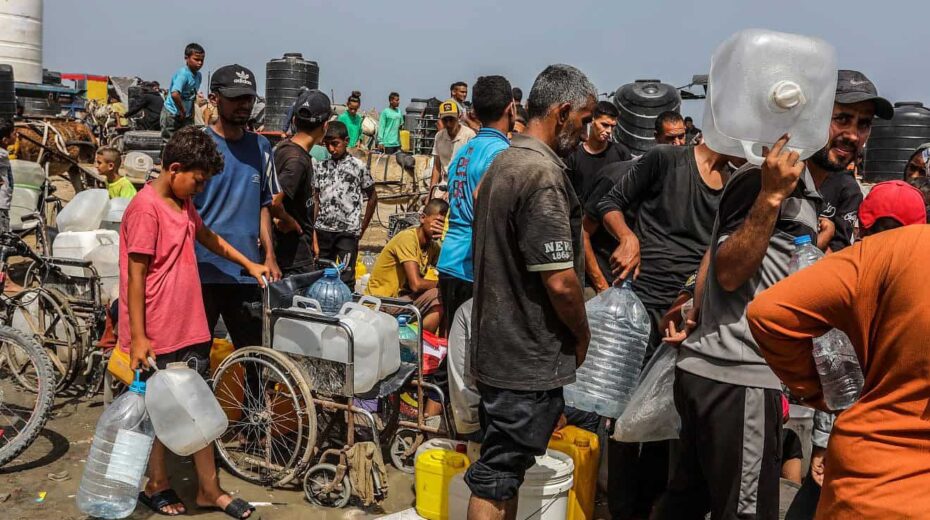 Palestinians line up in the Gaza Strip to receive drinkable water numbers while battles take place between Israel and Hamas in the southern city of Rafah on May 20, 2024. Photo by Abed Rahim Khatib/Flash90.