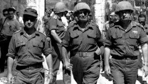 Six-Day War 1967: Defense Minister Moshe Dayan (C) enters the Old City through the Lions' Gate with Chief of Staff Yitzhak Rabin (r) and Jerusalem Commander Uzi Narkis. Photo: Ilan Bruner/GPO