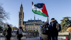 People outside the International Court of Justice (ICJ) in The Hague, Netherlands, on January 26, 2024, ahead of the ICJ's ruling on a South African request for emergency measures for Gaza. EPA-EFE/Remko de Waal