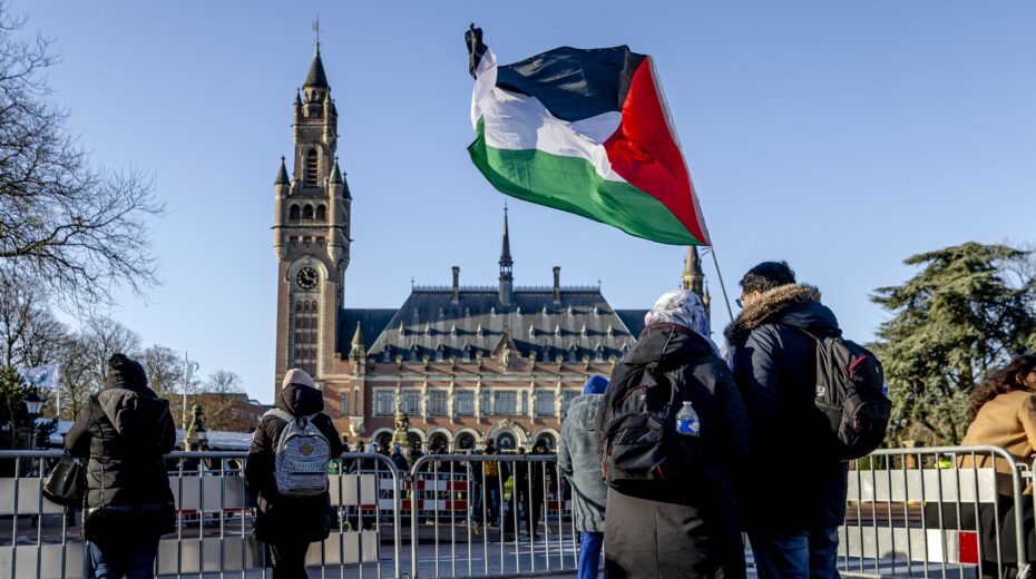 People outside the International Court of Justice (ICJ) in The Hague, Netherlands, on January 26, 2024, ahead of the ICJ's ruling on a South African request for emergency measures for Gaza. EPA-EFE/Remko de Waal