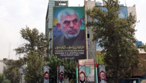 A billboard featuring new Hamas leader Yahya Sinwar hangs on a wall at Palestine Square in Tehran, Iran, August 12, 2024. Tensions between Iran and Israel remain high following the killing of former Hamas leader Ismail Haniyeh in Tehran on July 31, 2024. Iranian leader Ayatollah Khamenei promised "harsh punishment" of Israel in retaliation for Haniyeh's killing. Photo: EPA-EFE/ABEDIN TAHERKENAREH.