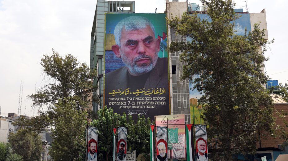 A billboard featuring new Hamas leader Yahya Sinwar hangs on a wall at Palestine Square in Tehran, Iran, August 12, 2024. Tensions between Iran and Israel remain high following the killing of former Hamas leader Ismail Haniyeh in Tehran on July 31, 2024. Iranian leader Ayatollah Khamenei promised "harsh punishment" of Israel in retaliation for Haniyeh's killing. Photo: EPA-EFE/ABEDIN TAHERKENAREH.