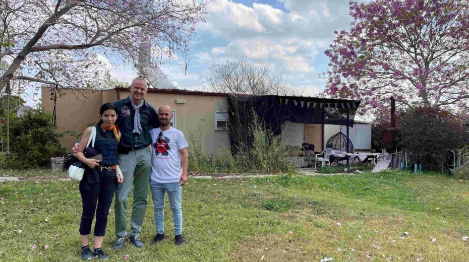 Avishay with us in front of his damaged house in Kfar Azza. April 2024. Private photo.