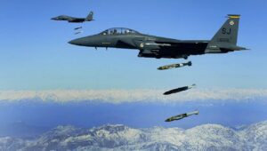 US Air Force F-15Es drop 2,000-pound Joint Direct Attack Munitions on a cave in eastern Afghanistan, Nov. 26, 2009. Credit: Staff Sgt. Michael B. Keller/US Air Force Photo via Wikimedia Commons.