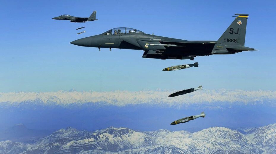 US Air Force F-15Es drop 2,000-pound Joint Direct Attack Munitions on a cave in eastern Afghanistan, Nov. 26, 2009. Credit: Staff Sgt. Michael B. Keller/US Air Force Photo via Wikimedia Commons.