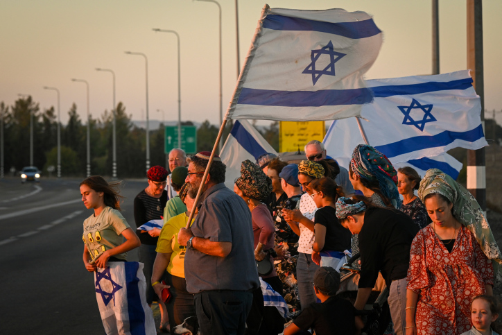 Israelis gather with national flags at 100 locations nationwide to strengthen the country's unity, Hispin, Golan Heights, on August 8, 2024. Photo by Michael Giladi/Flash90