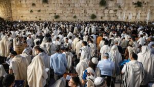 Jewish men pray during Tisha B'Av at the Western Wall in the Old City of Jerusalem, July 27, 2023. Photo by Chaim Goldberg/Flash90.