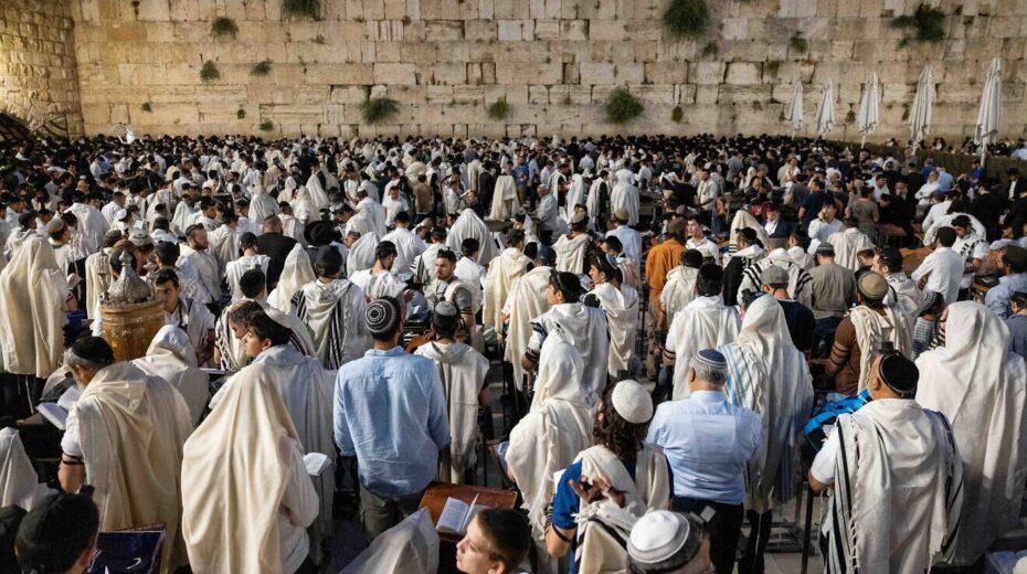 Jewish men pray during Tisha B'Av at the Western Wall in the Old City of Jerusalem, July 27, 2023. Photo by Chaim Goldberg/Flash90.