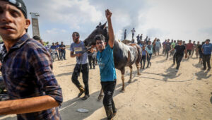 Palestinians near the border fence with Israel from Khan Yunis in the southern Gaza Strip, October 7, 2023. Photo by Abed Rahim Khatib/Flash90
