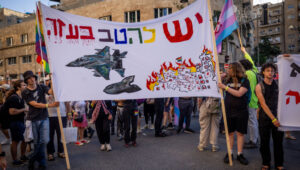 Israeli protesters claiming there are LGBTQ communities being bombed as part of the IDF offensive in Gaza. Photo by Thousands take part in the annual Gay Pride Parade in Jerusalem, on May 30, 2024. Photo by Yonatan Sindel/Flash90