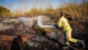 A firefighter after a Yemeni missile hit near Moshav Kfar Daniel, between Modi'in and Ben-Gurion Airport, Sept. 15, 2024. Photo by Yossi Aloni/Flash90.