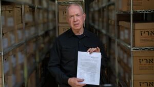 Israeli Defense Minister Yoav Gallant holds a document written by the former commander of Hamas's Khan Younis Brigade, Rafa'a Salameh, at an IDF intelligence base in central Israel, Sept. 11, 2024. Photo by Ariel Hermoni/Defense Ministry.