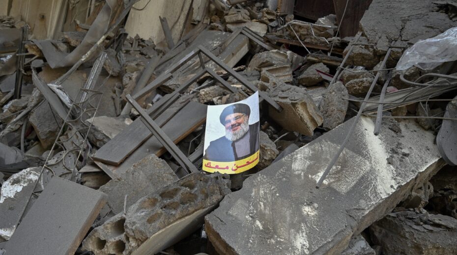 A picture of slain Hezbollah leader Hassan Nasrallah over the rubble of a damaged building after an Israeli airstrike in Al Mreijeh, in the southern suburbs of Beirut, Lebanon, October 4, 2024. Photo: EPA-EFE/WAEL HAMZEH