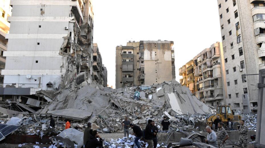 People inspect the site of an Israeli airstrike on a branch of the Al-Qard Al-Hassan financial group in Al-Shiyah, Beirut, Lebanon, on October 21, 2024. Photo: EPA-EFE/STR