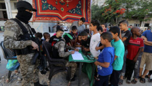 Hamas terrorists sign up Palestinian youth to "Sword of Jerusalem" camps, in Rafah, the southern Gaza Strip, on June 14, 2021. Photo by Abed Rahim Khatib/Flash90.